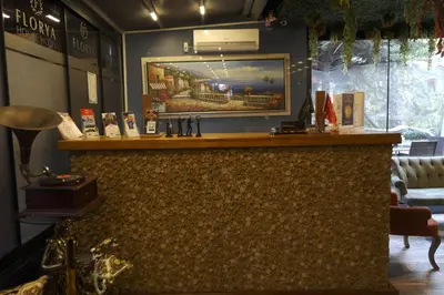 a bar in a restaurant with a tv on the wall at Florya House Hotel in Istanbul