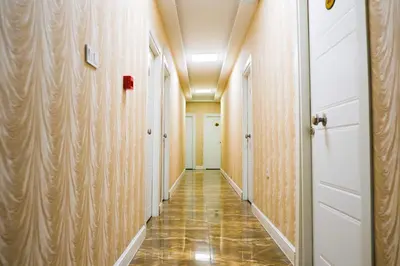 a corridor of a hallway with wooden walls at Florya House Hotel in Istanbul