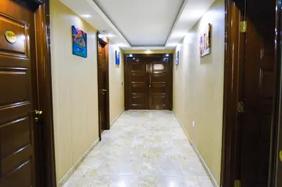 a hallway with two doors and a tile floor at Florya House Hotel in Istanbul