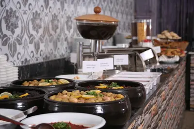 a buffet line with many different types of food at Formback Thermal Suit & Apart in Bursa