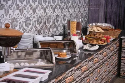 a buffet line with food on top at Formback Thermal Suit & Apart in Bursa