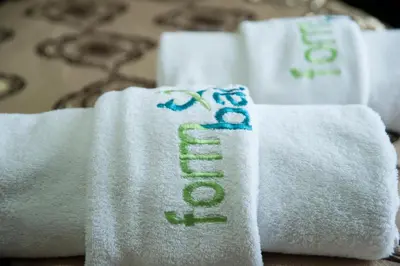 a white towel with the word spa written on it at Formback Thermal Suit & Apart in Bursa