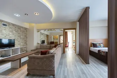 a living room with a couch and a bed at Formback Thermal Suit & Apart in Bursa