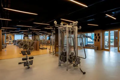 a gym with several treadmills and exercise bikes at Windsor Hotel & Convention Center Istanbul in Istanbul