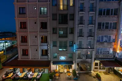 an apartment building at night with a patio at Elanaz Hotel in Istanbul