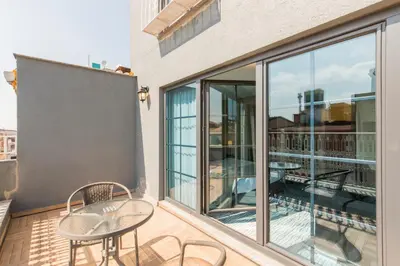 a patio with a table and chairs on a balcony at Aston Hotel Taksim in Istanbul