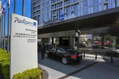 a black car parked in front of a building at Radisson Blu Hotel Istanbul Asia in Istanbul