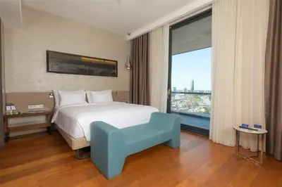 a hotel room with a bed and a large window at Radisson Blu Hotel Istanbul Asia in Istanbul