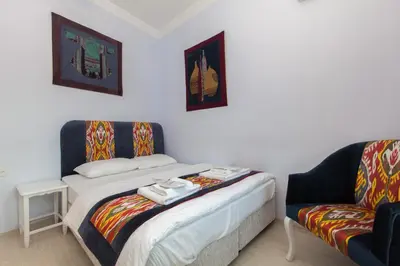 a small room with a bed and a couch at SUFI APART Otel in Istanbul