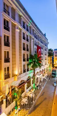 a building with tables and chairs in front of it at Baron Hotel & Spa in Istanbul