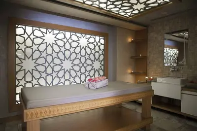 a bathroom with a bench in front of a window at Baron Hotel & Spa in Istanbul
