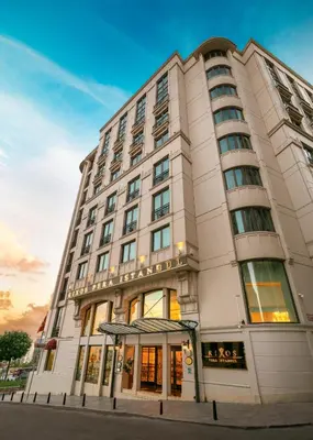 a tall white building on a city street at Rixos Pera Istanbul in Istanbul