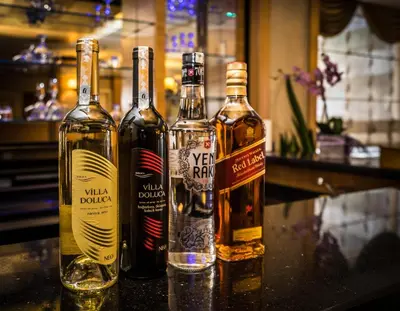 three bottles of whiskey sitting on a counter at My Rose Hotel in Istanbul