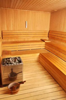 an inside of a wooden sauna with a tub at Sorriso Hotel in Istanbul