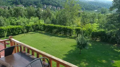 a view of a garden from a balcony at Cevizdibi Hotel in Masukiye
