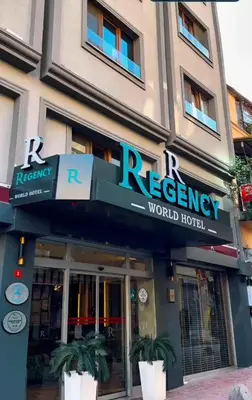 a restaurant with a sign on the front of a building at Regency World Hotel in Istanbul