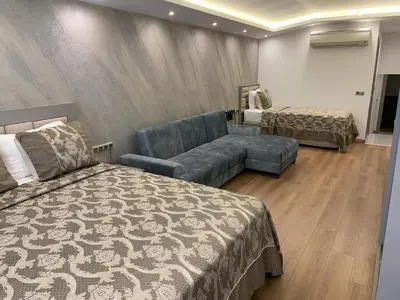 a hotel room with a couch and a bed at Regency World Hotel in Istanbul