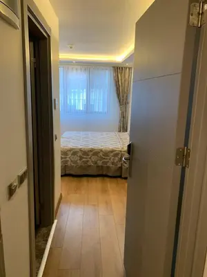 a small bedroom with a bed and a window at Regency World Hotel in Istanbul