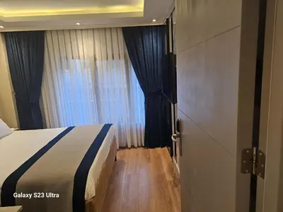 a hotel room with a bed and a window at Regency World Hotel in Istanbul