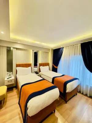 a hotel room with two beds in a room at Regency World Hotel in Istanbul