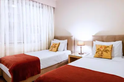 a hotel room with two beds and a window at Cheya Beşiktaş Istanbul Bosphorus City Center Hotel & Suites in Istanbul