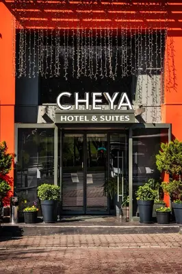 a building with a sign for a hotel and suites at Cheya Beşiktaş Istanbul Bosphorus City Center Hotel & Suites in Istanbul