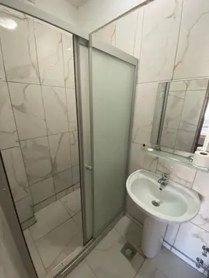 a bathroom with a shower and a sink at Kadikoy Kervansaray Hotel in Istanbul