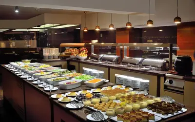 a buffet line with many different types of food at Tiara Thermal & SPA Hotel in Bursa