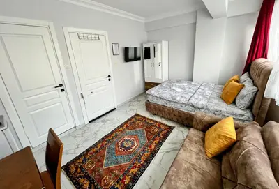 a living room with a bed and a couch at Pembe Hotel in Istanbul