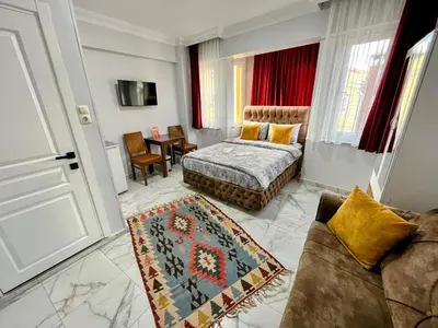 a living room with a bed and a couch at Pembe Hotel in Istanbul