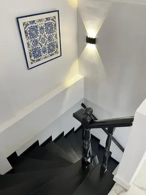 a stairwell with a bench and a picture on the wall at Pembe Hotel in Istanbul