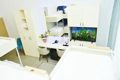 a room with a desk with a computer in it at Nar Palace in Istanbul