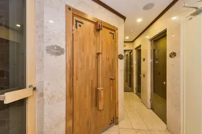 a hallway with a wooden door in a building at Darkmen Hotel in Istanbul