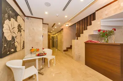 a hallway with a table and chairs and a staircase at Darkmen Hotel in Istanbul