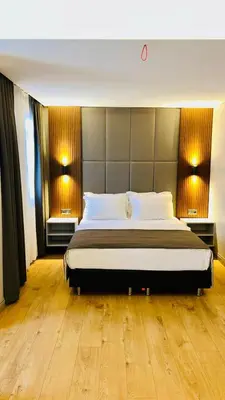 a bedroom with a large bed and two windows at Akbiyik Suite Boutique Hotel in Istanbul