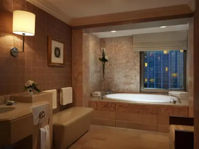 a bathroom with a tub and a toilet and a sink at Grand Hyatt Istanbul in Istanbul