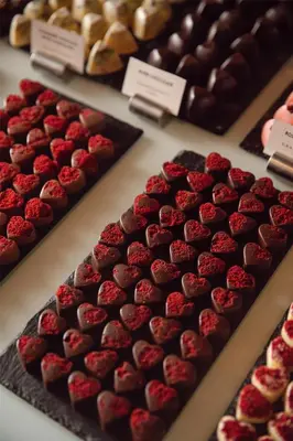a display of chocolate and strawberries on display in a bakery at Grand Hyatt Istanbul in Istanbul