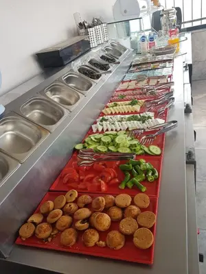 a buffet line with many different types of food at Seahouse Suites in Istanbul