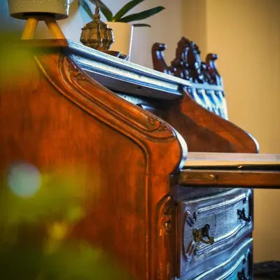 a close up of a wooden piano with at Panderma Port Hotel in Bandırma