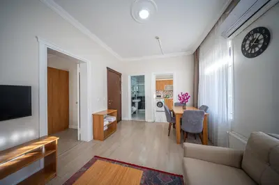 a living room with a couch and a table at Feyza Apart in Istanbul