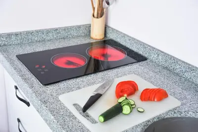 a cutting board with vegetables and a knife on a counter at Feyza Apart in Istanbul