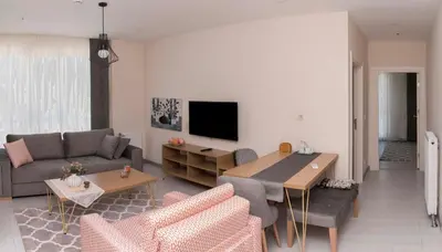 a living room with a couch and a table at Zin D Home Otel Alemdağ in Istanbul