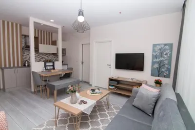 a living room with a couch and a table at Zin D Home Otel Alemdağ in Istanbul