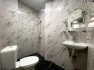 a bathroom with a toilet and a sink at Hotel Yasmin in Istanbul