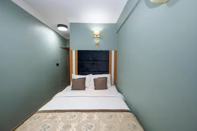 a small bed in a room with a window at Ista Palace Hotel in Istanbul