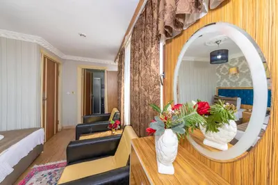 a hotel room with a bed and a mirror at Ista Palace Hotel in Istanbul