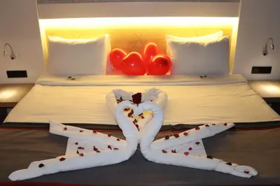 a bed with two people made out of hearts at DES'OTEL in Tekirdag