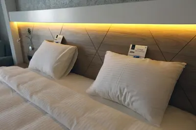 a bed with two pillows on top of it at DES'OTEL in Tekirdag