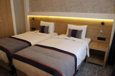 two beds sitting next to each other in a hotel room at DES'OTEL in Tekirdag