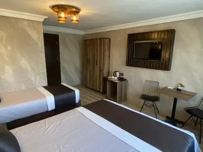 a hotel room with a bed and a television at Insta Hotel Karakoy in Istanbul